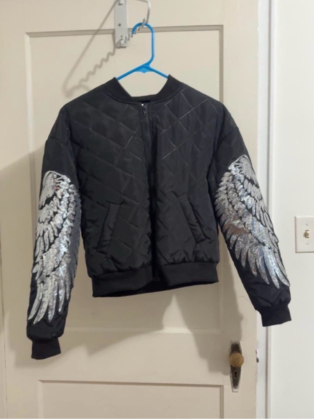 Women’s Black Quilted Puffer Jacket with Silver Wing Detail